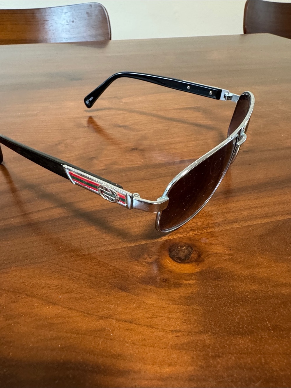 Black Sunglasses with Red-Green Stripe Accent
